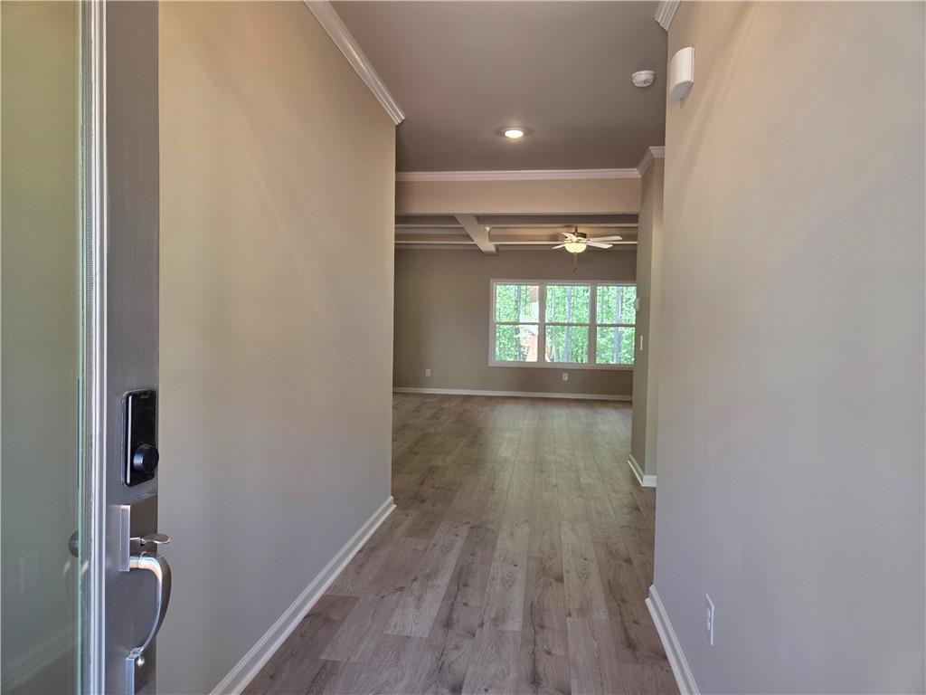 293 Meadows Drive Bethlehem, GA 30620 - Photo 2 of 34 a view of hallway with a window and wooden floor