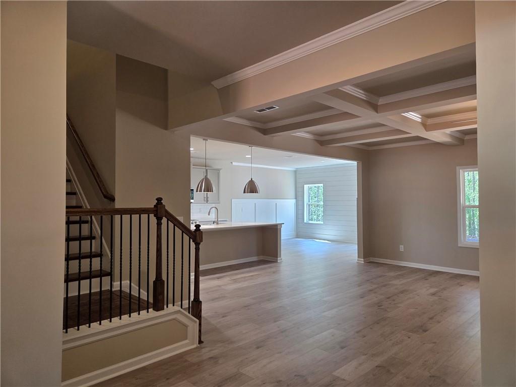 293 Meadows Drive Bethlehem, GA 30620 - Photo 7 of 34 a view of gallery with wooden floor