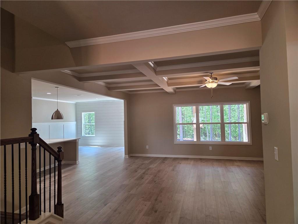 293 Meadows Drive Bethlehem, GA 30620 - Photo 9 of 34 a view of empty room with wooden floor and fan