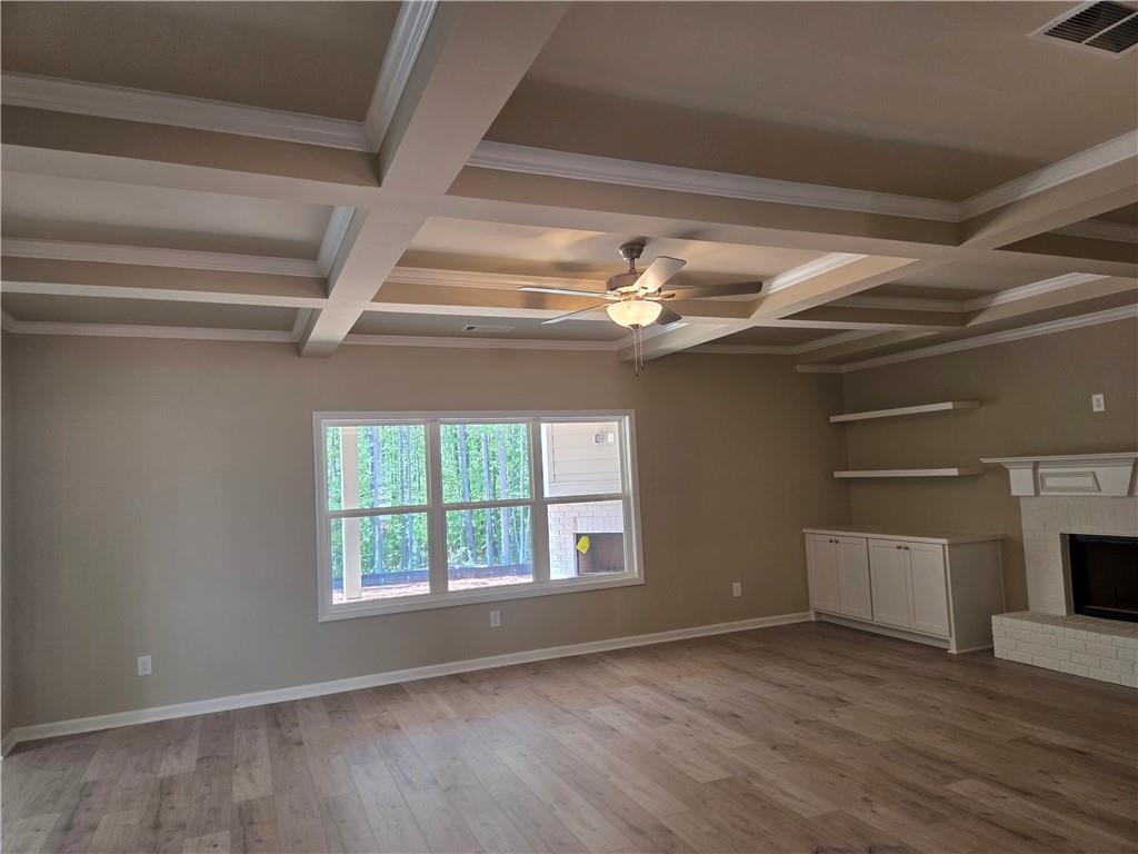293 Meadows Drive Bethlehem, GA 30620 - Photo 10 of 34 a view of an empty room with wooden floor and a window