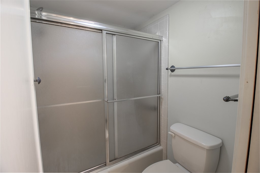 1127 Lois Street Kerrville, TX 78028 - Photo 14 of 23 a bathroom with a shower and a toilet