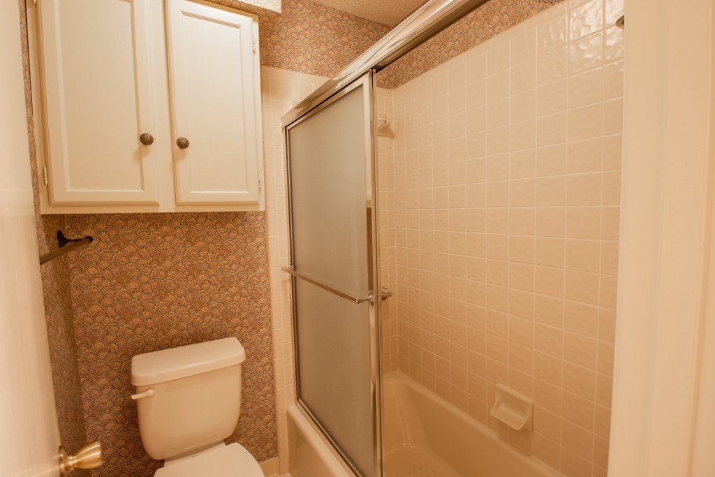 1127 Lois Street Kerrville, TX 78028 - Photo 19 of 23 a bathroom with a toilet and a shower