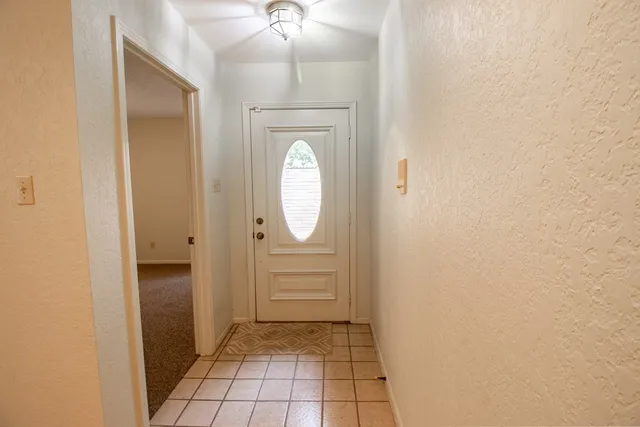 an empty room with mirror