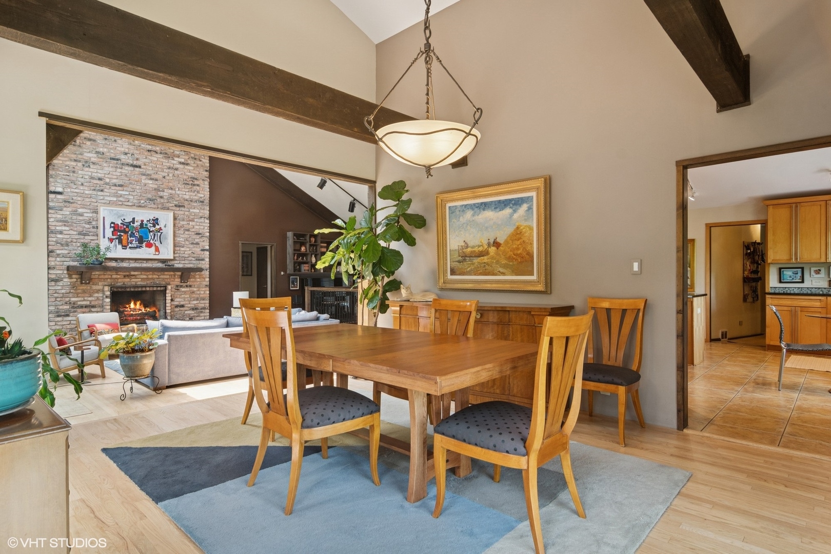 284 Oxford Road North Barrington, IL 60010 - Photo 16 of 48 a dining room with wooden floor a chandelier a wooden table and chairs