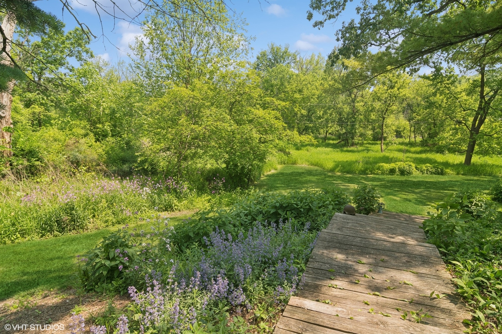 284 Oxford Road North Barrington, IL 60010 - Photo 44 of 48 a view of a yard with plants and large trees