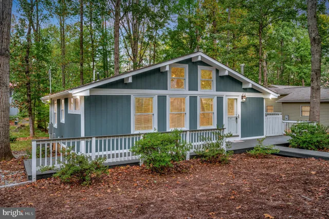 a view of a house with a yard and plants