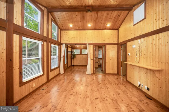 a kitchen with stainless steel appliances granite countertop a stove a refrigerator and a cabinets