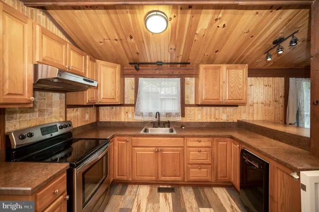 a bathroom with a toilet a sink and a mirror