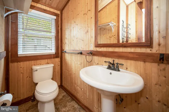 a view of house with wooden deck