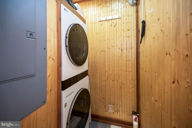 a view of a house with wooden deck