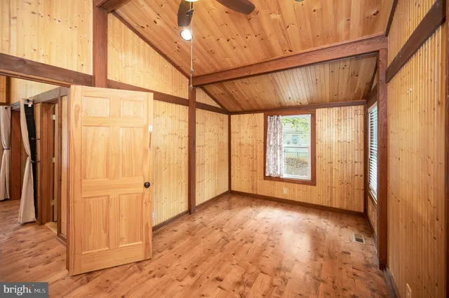 a view of balcony with wooden floor and fence