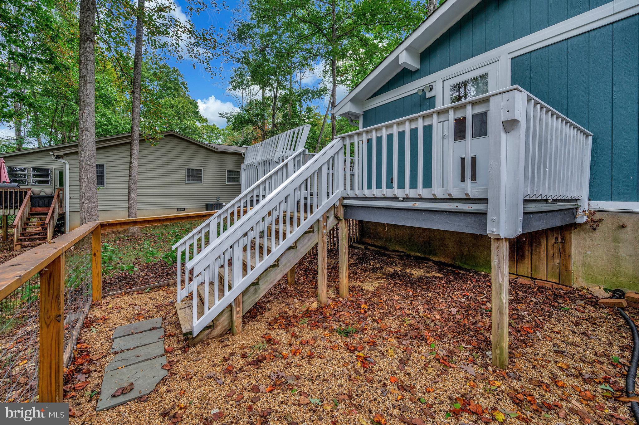 4239 Lakeview Parkway Locust Grove, VA 22508 - Photo 38 of 65 a view of a house with wooden deck