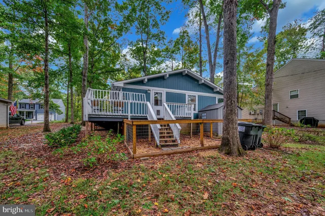 a backyard of a house with outdoor seating