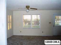 124 Foursquare Road, Unit 124B Mooresville, NC 28115 - Photo 2 of 3 a view of an empty room and window