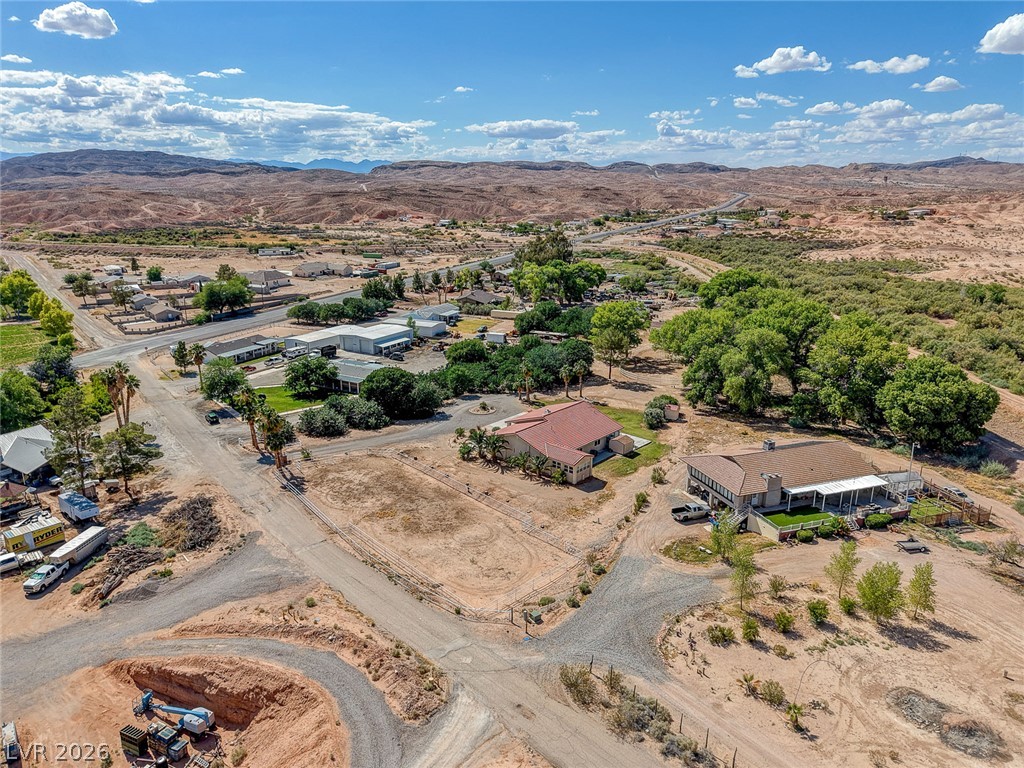 1950 Bowman Road Logandale, NV 89021 - Photo 76 of 81 An aerial perspective reveals a charming desert community nestled against a backdrop of rugged mountains.