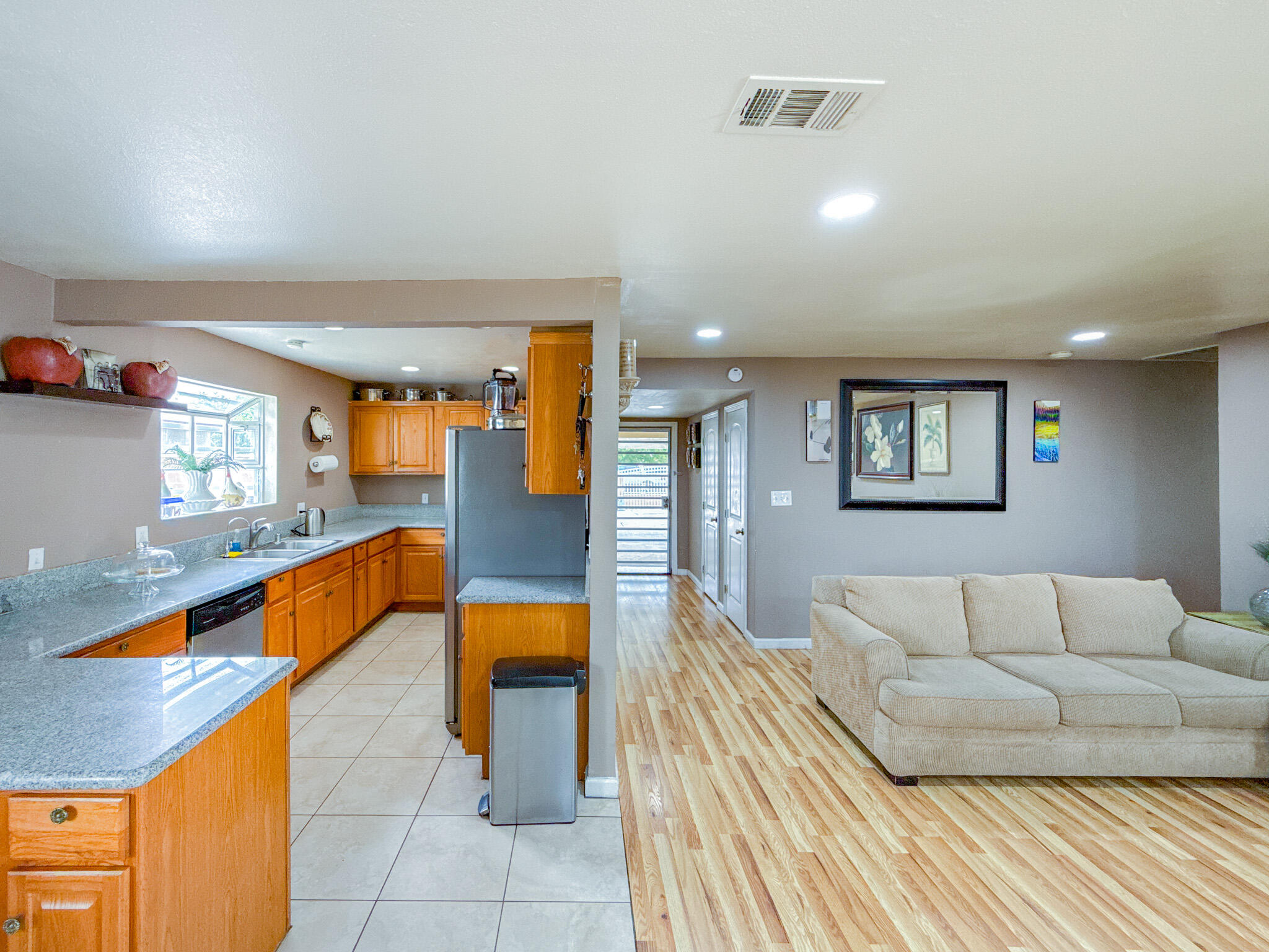 45431 Sancroft Avenue Lancaster, CA 93535 - Photo 12 of 49 a living room with furniture and a couch