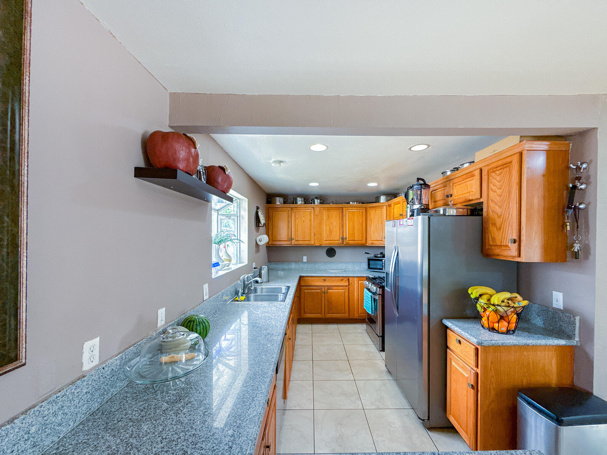 45431 Sancroft Avenue Lancaster, CA 93535 - Photo 14 of 49 a living room with furniture and a couch