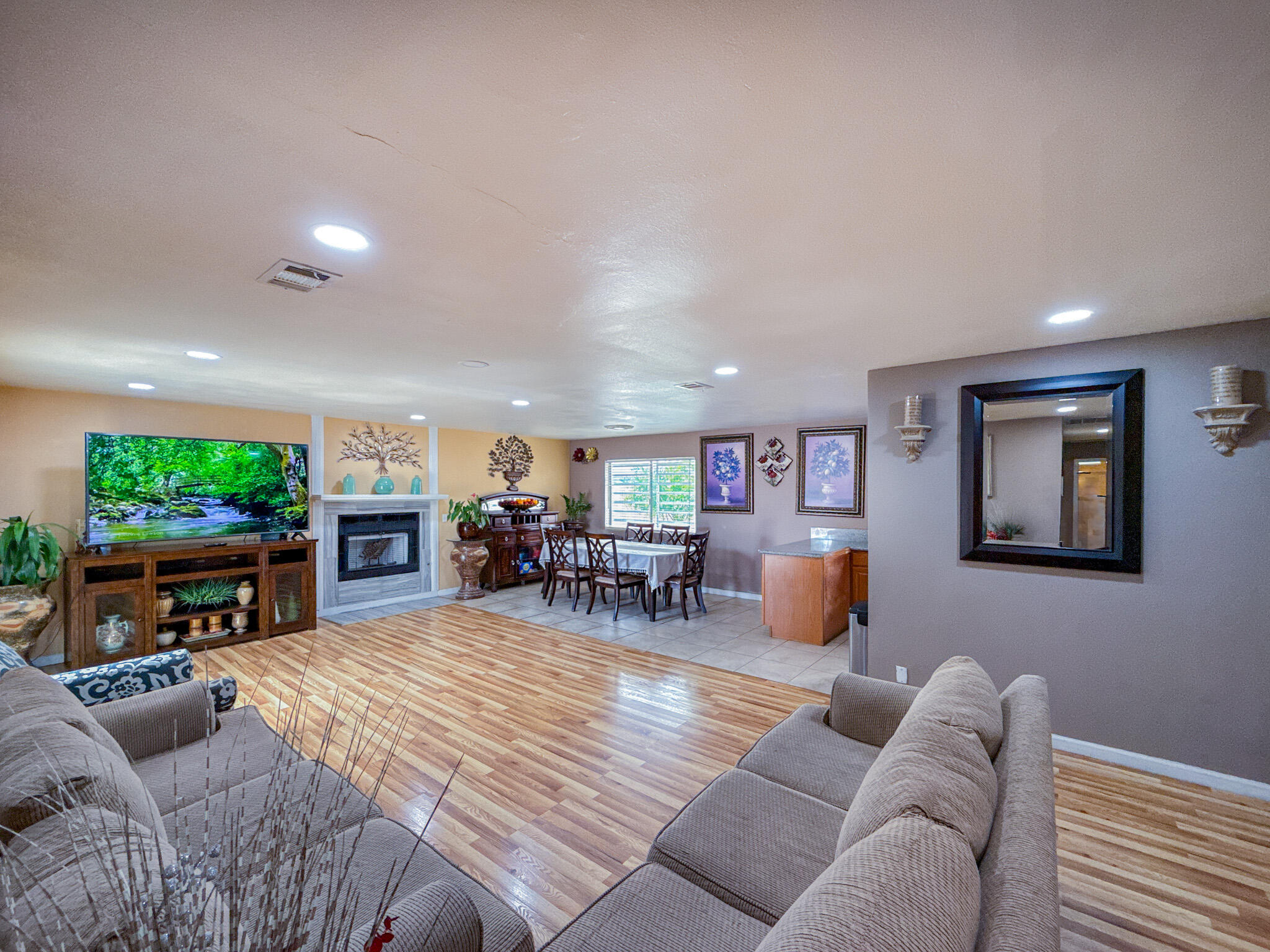 45431 Sancroft Avenue Lancaster, CA 93535 - Photo 18 of 49 a living room with furniture and a fireplace