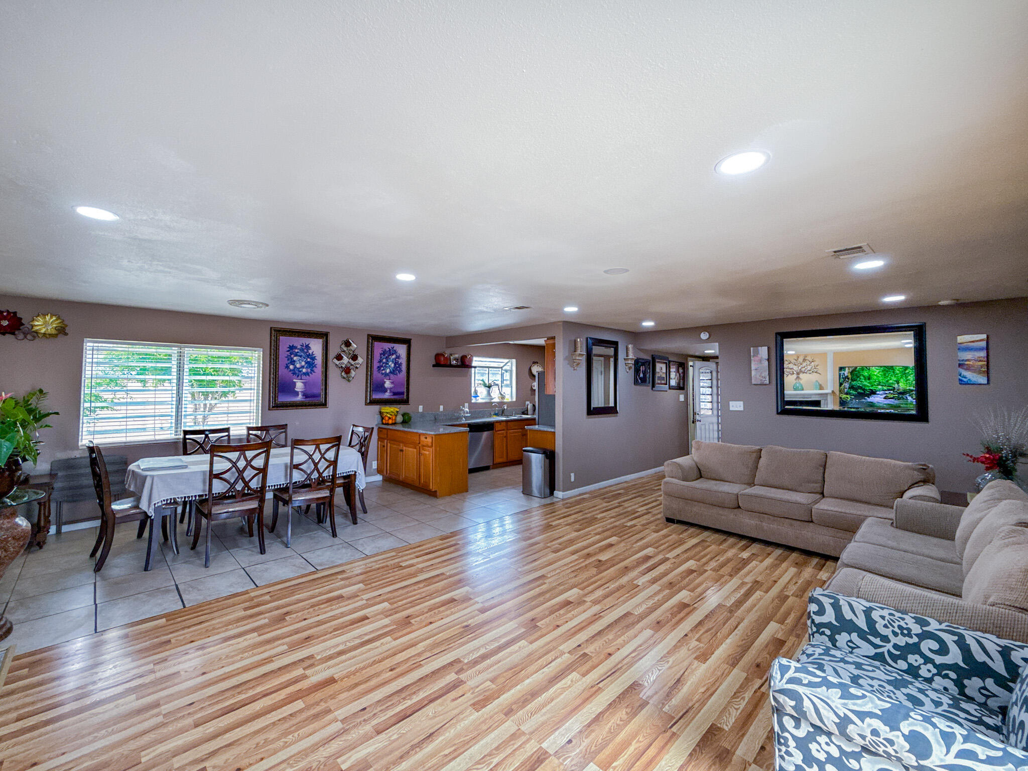 45431 Sancroft Avenue Lancaster, CA 93535 - Photo 19 of 49 a living room with furniture and a wooden floor