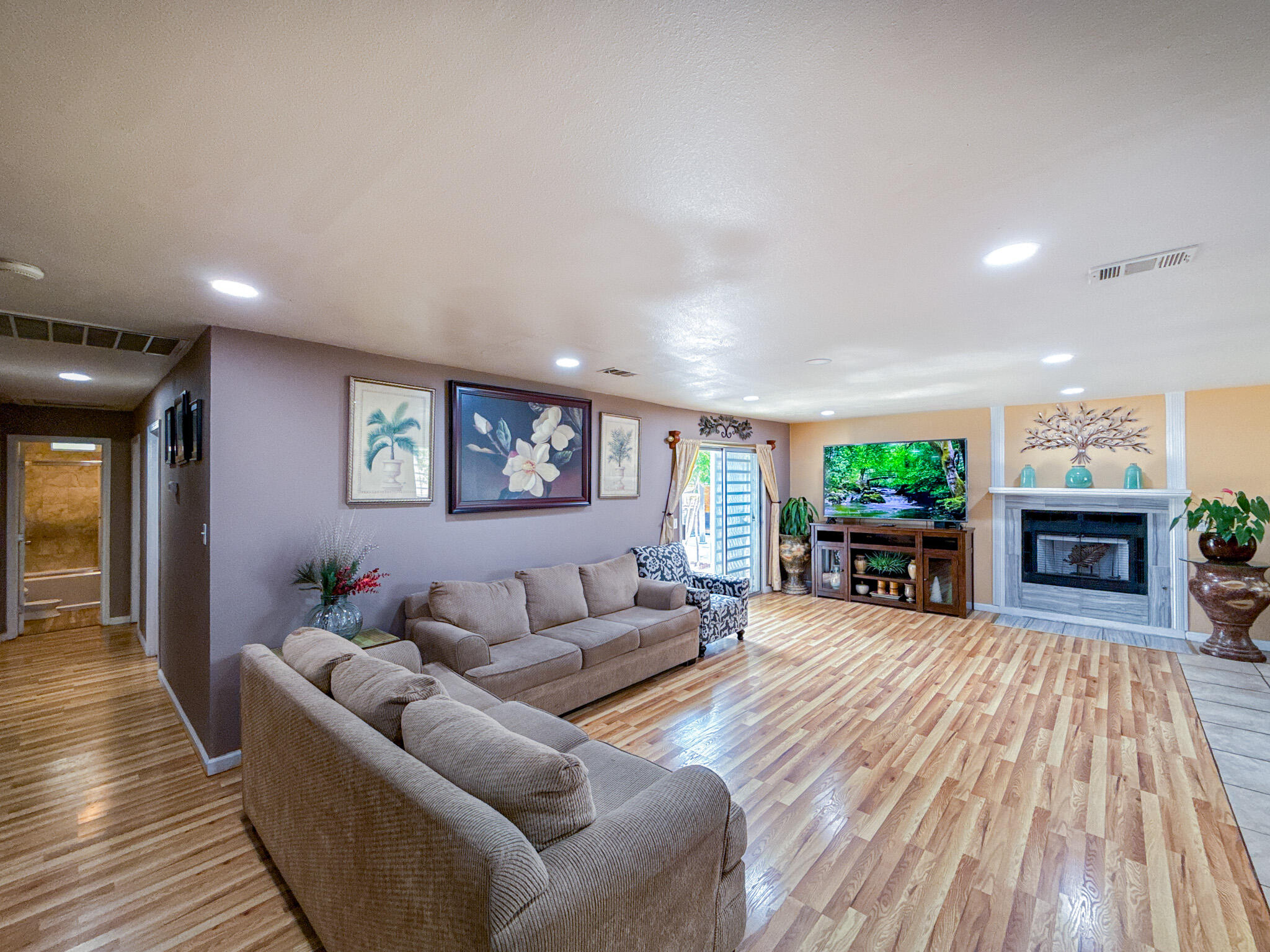 45431 Sancroft Avenue Lancaster, CA 93535 - Photo 20 of 49 a living room with furniture and a fireplace