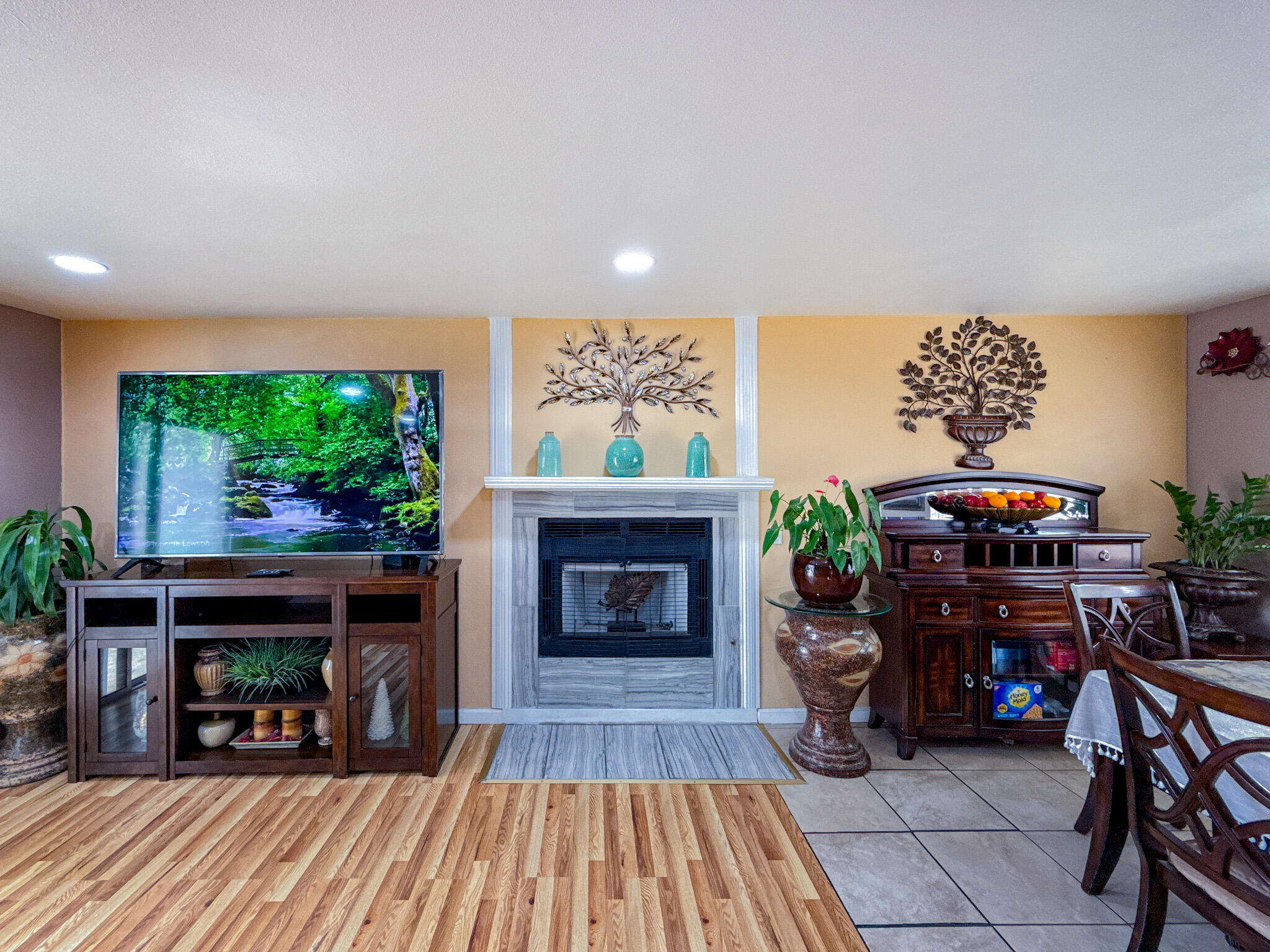 45431 Sancroft Avenue Lancaster, CA 93535 - Photo 21 of 49 a living room with furniture and a fireplace