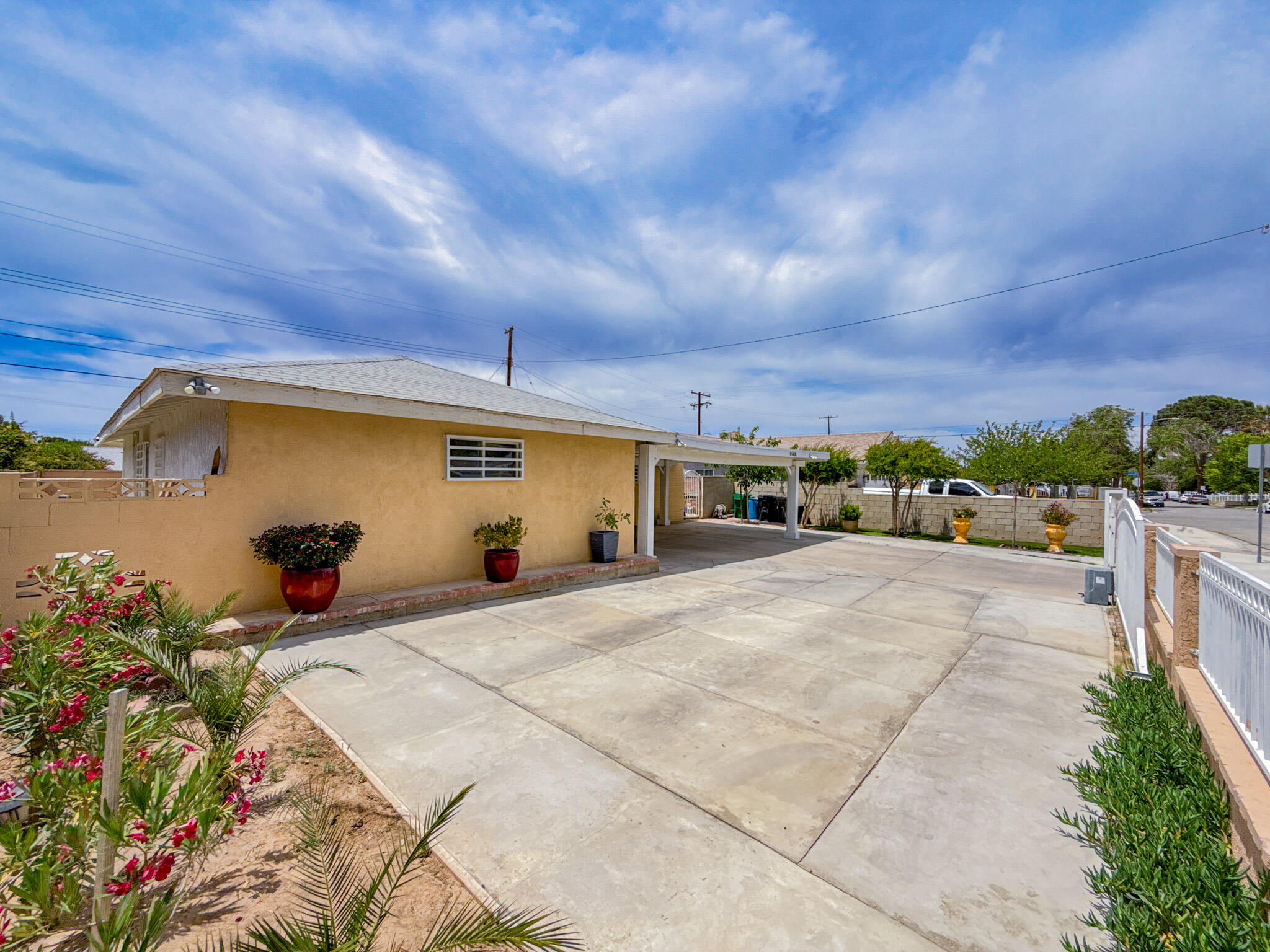 45431 Sancroft Avenue Lancaster, CA 93535 - Photo 3 of 49 a front view of a house with a yard