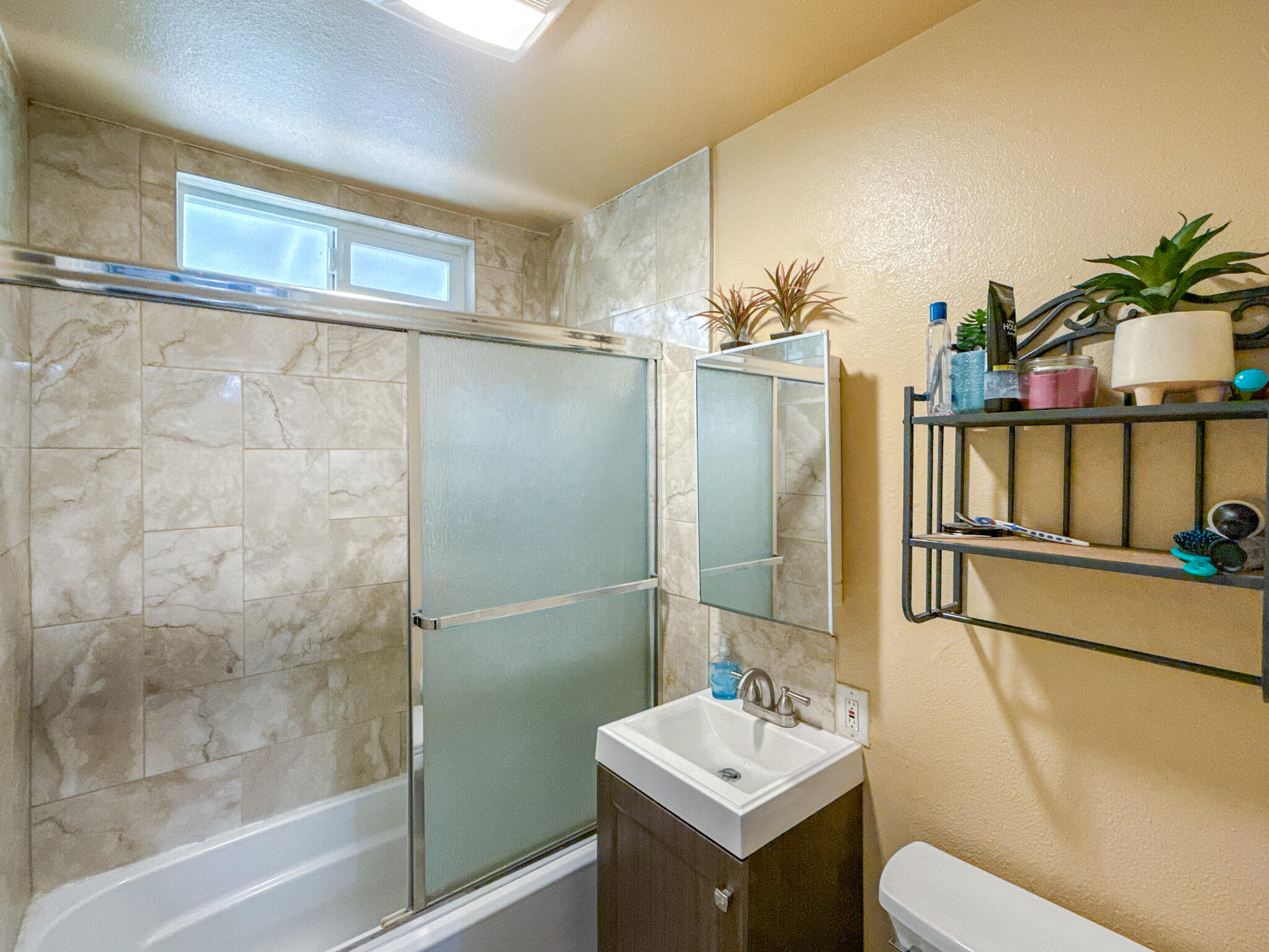 45431 Sancroft Avenue Lancaster, CA 93535 - Photo 33 of 49 a bathroom with a sink toilet and shower