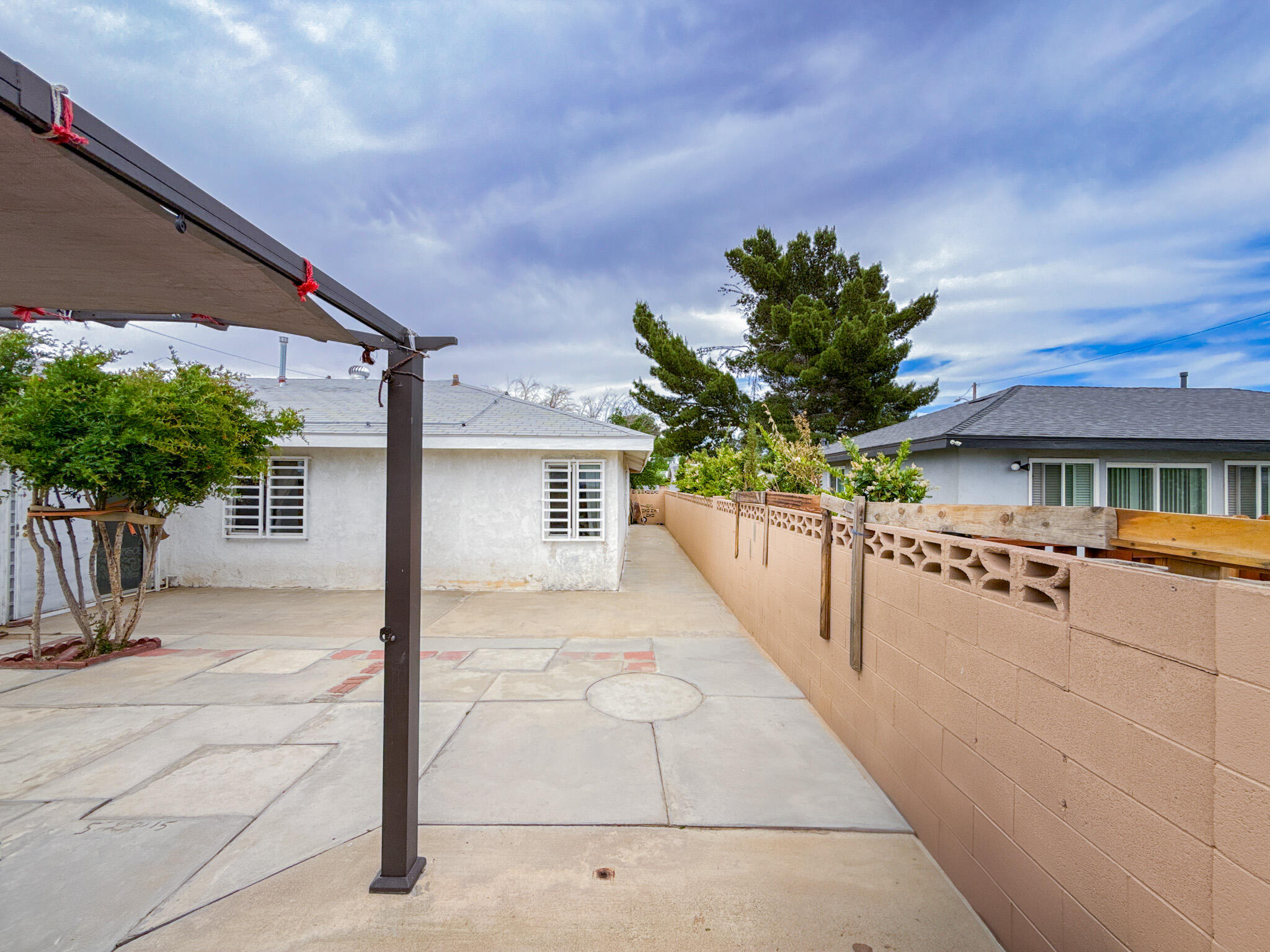 45431 Sancroft Avenue Lancaster, CA 93535 - Photo 36 of 49 a view of a house with a porch