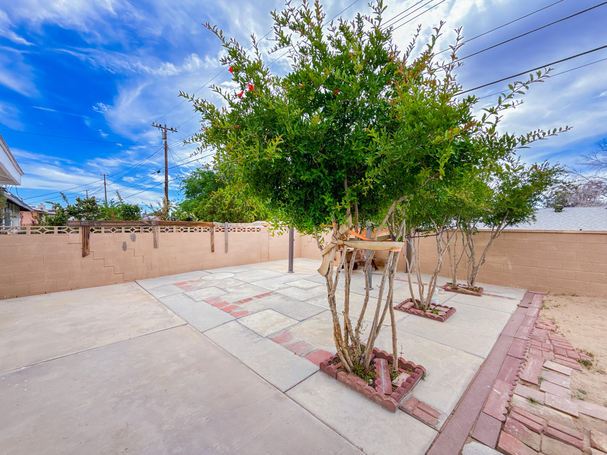 45431 Sancroft Avenue Lancaster, CA 93535 - Photo 39 of 49 a view of a patio with a table and chairs