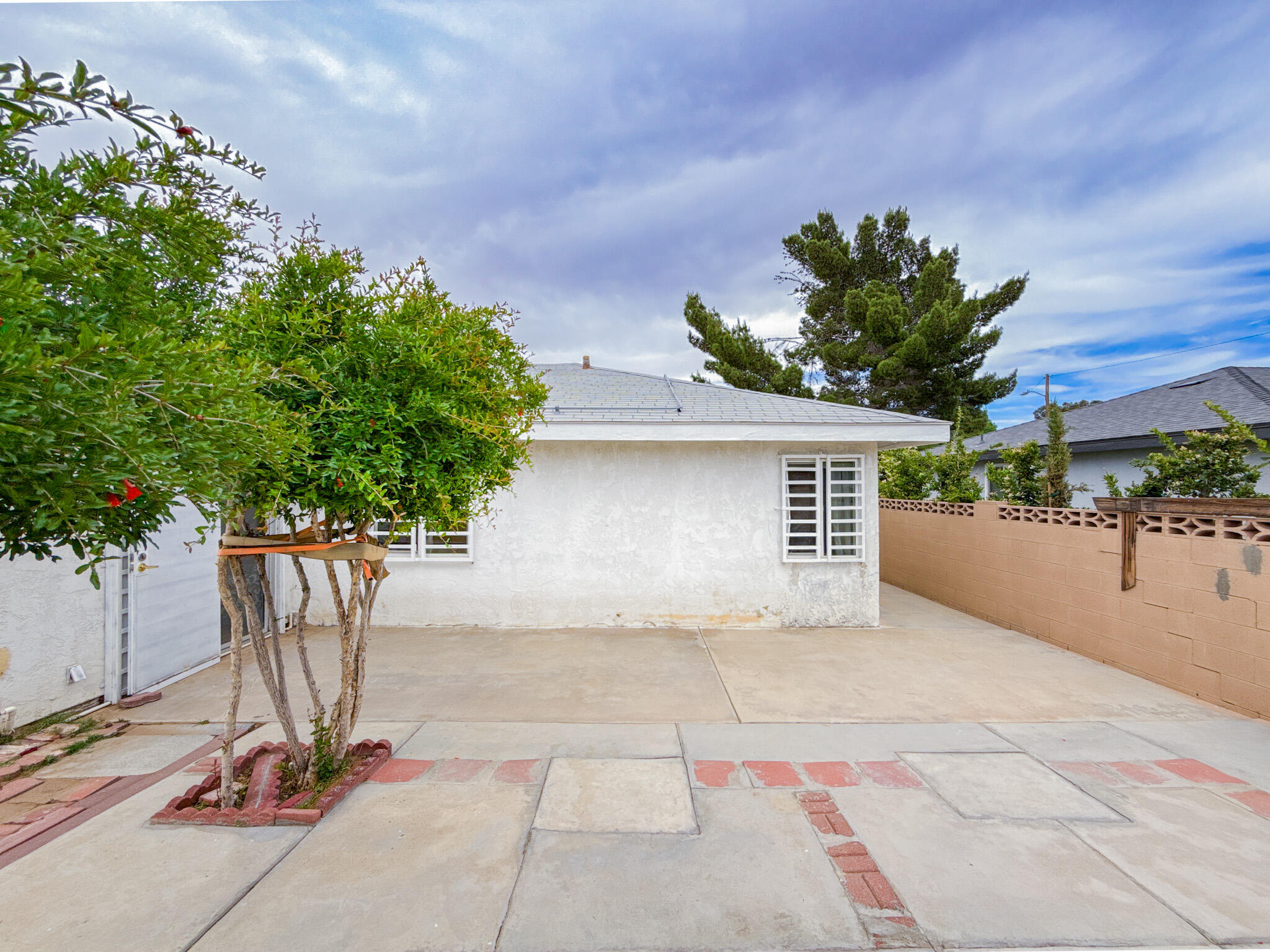 45431 Sancroft Avenue Lancaster, CA 93535 - Photo 40 of 49 a view of a house with a yard and a garage