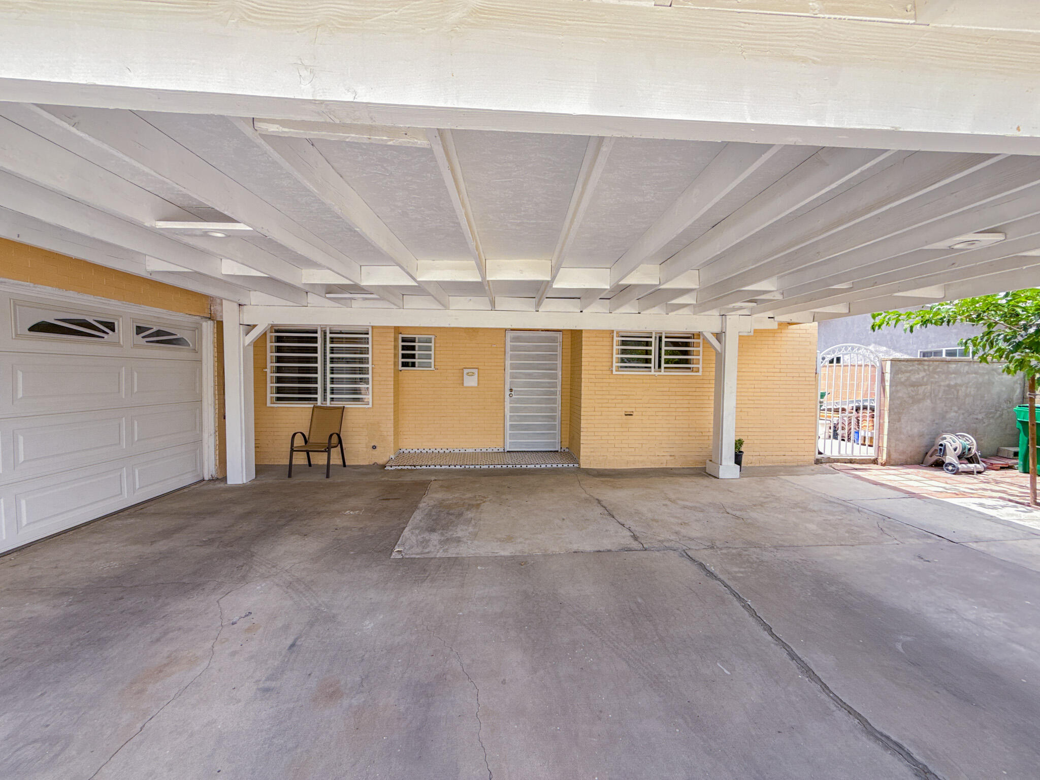 45431 Sancroft Avenue Lancaster, CA 93535 - Photo 7 of 49 a view of a room with a garage