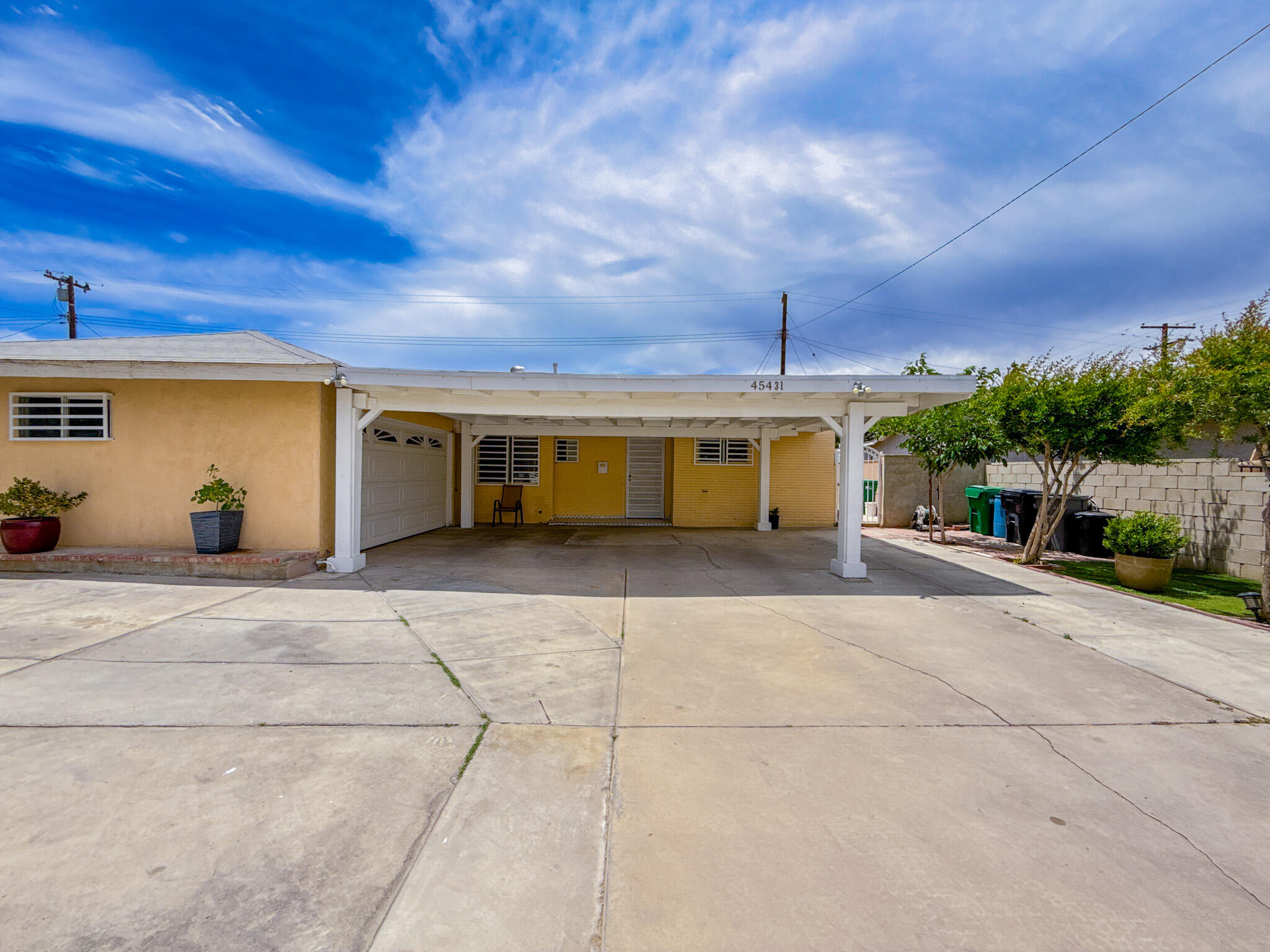45431 Sancroft Avenue Lancaster, CA 93535 - Photo 8 of 49 a view of a house with a garage