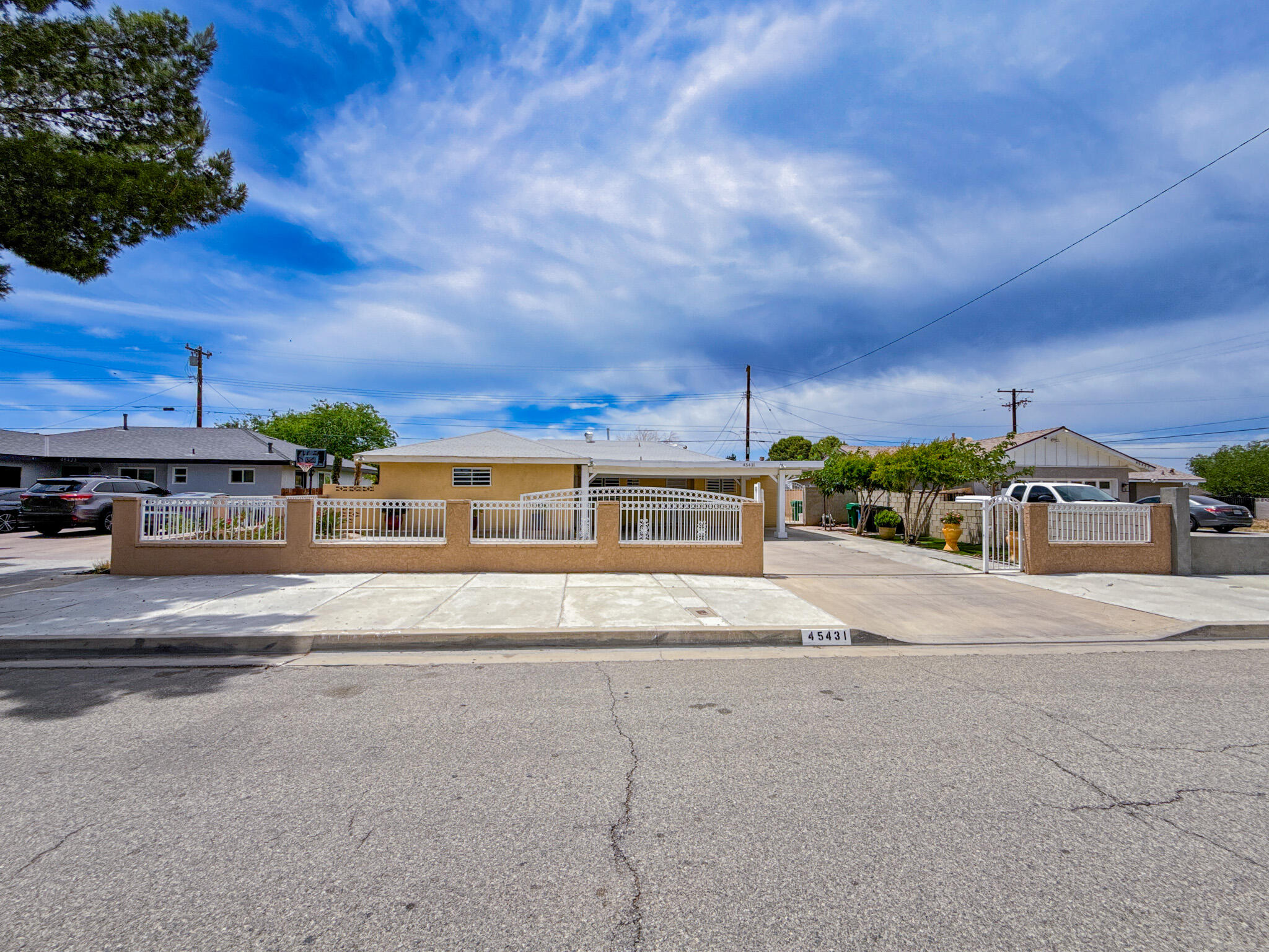 45431 Sancroft Avenue Lancaster, CA 93535 - Photo 9 of 49 front view of a house with a street