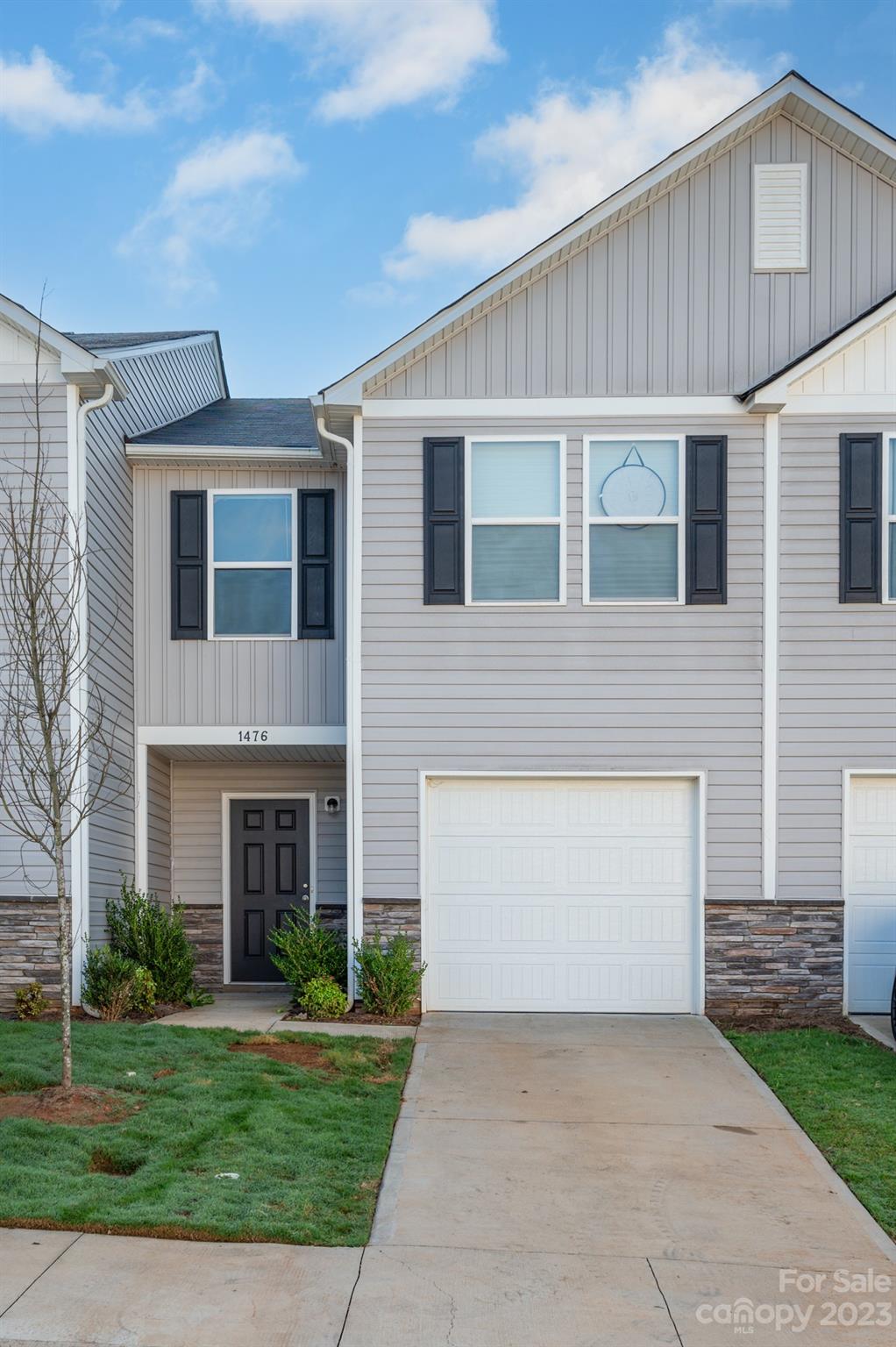 1476 Mulberry Ridge Drive Newton, NC 28658 - Photo 2 of 34 a front view of a house with a yard and garage