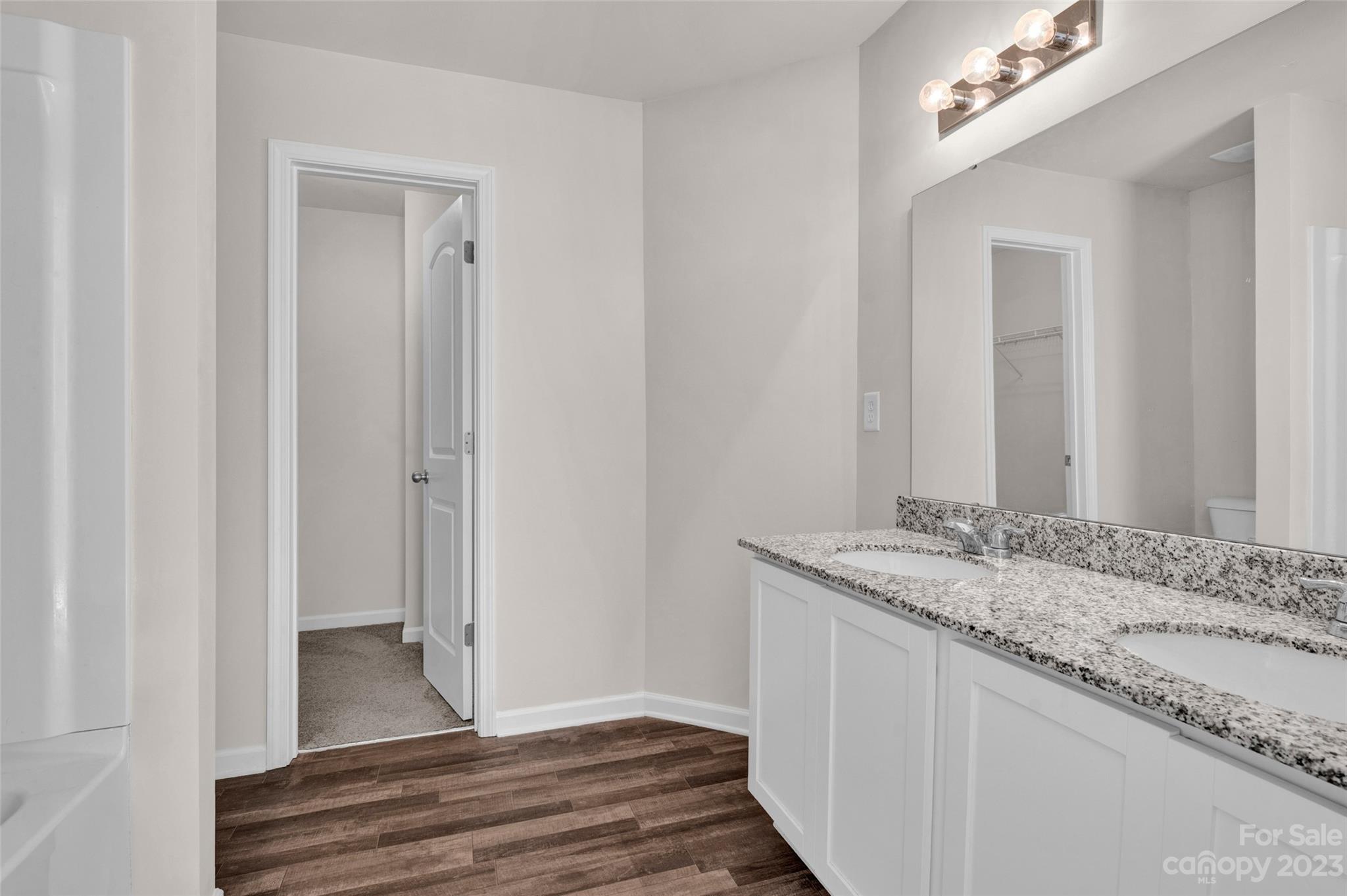 1476 Mulberry Ridge Drive Newton, NC 28658 - Photo 22 of 34 a bathroom with a sink and a mirror