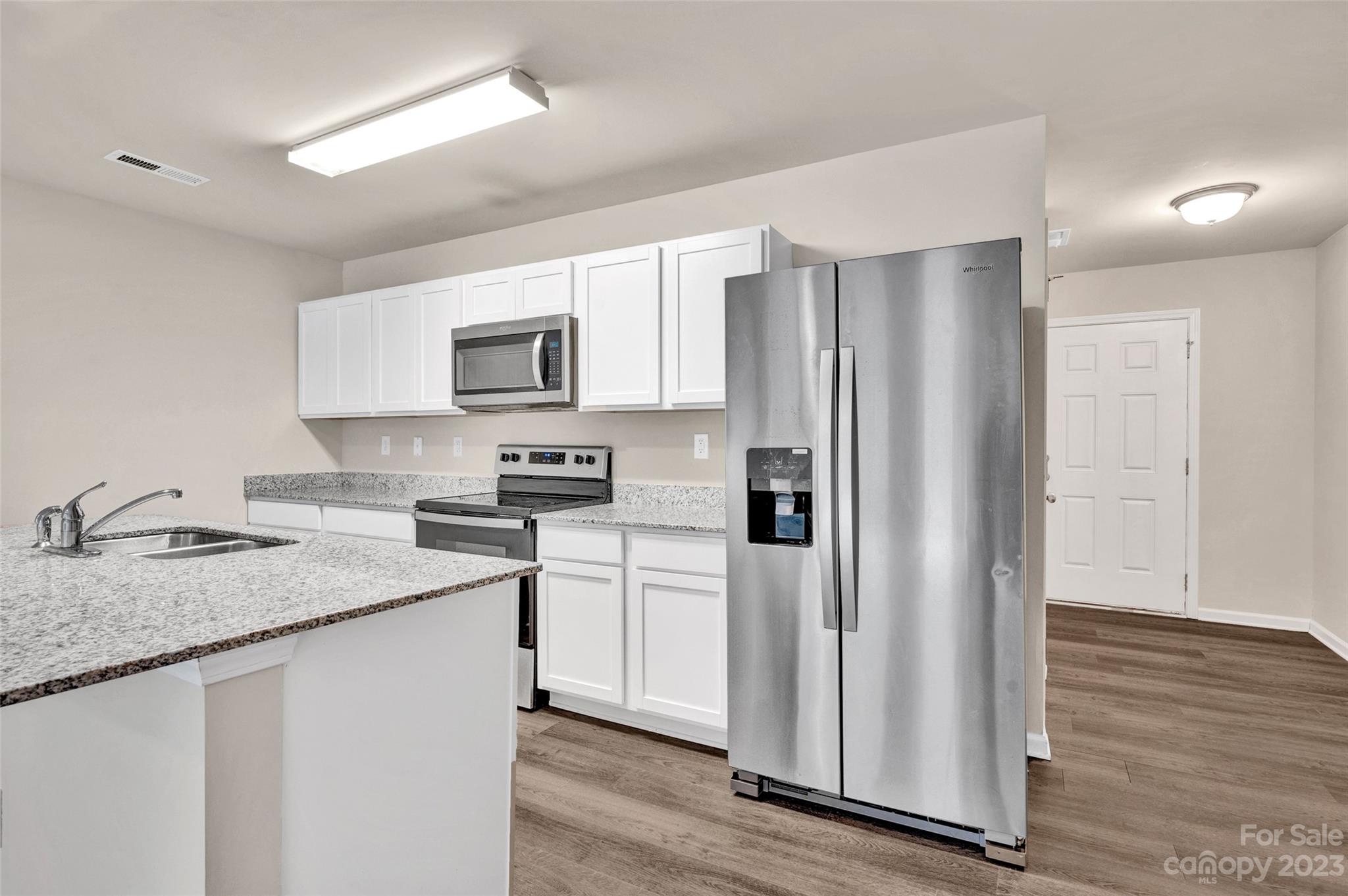 1476 Mulberry Ridge Drive Newton, NC 28658 - Photo 9 of 34 a kitchen with stainless steel appliances granite countertop a refrigerator sink and stove