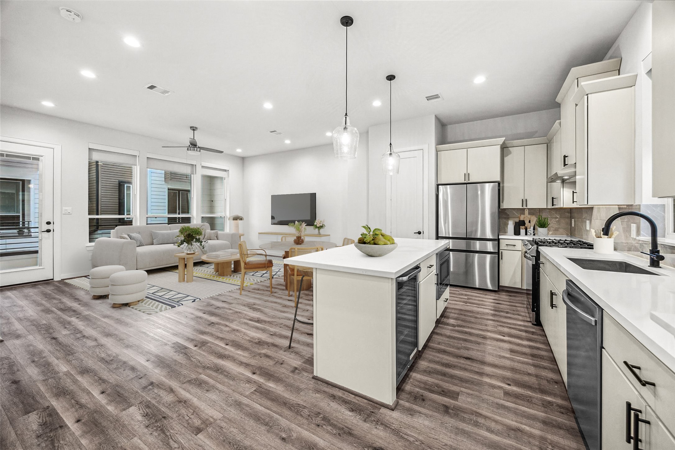 1603 Patterson Street, Unit E Houston, TX 77007 - Photo 16 of 32 a large kitchen with stainless steel appliances kitchen island granite countertop a large stove a sink dishwasher and white cabinets with wooden floor