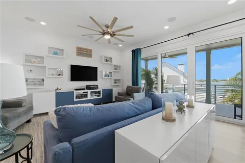 a large bedroom with a bed and a large window