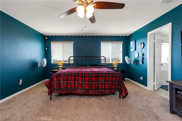 a room with a bed and window