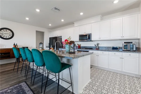 a kitchen with a dining table and chairs