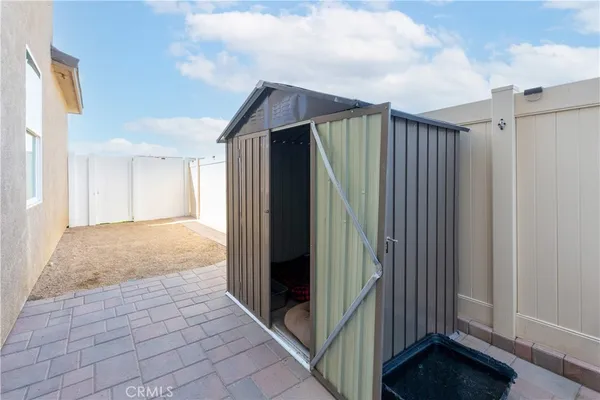 a view of a back yard from a hallway