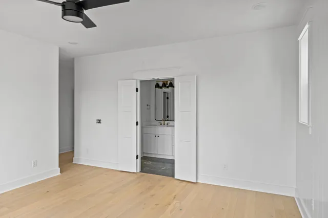 a view of a room with a ceiling fan