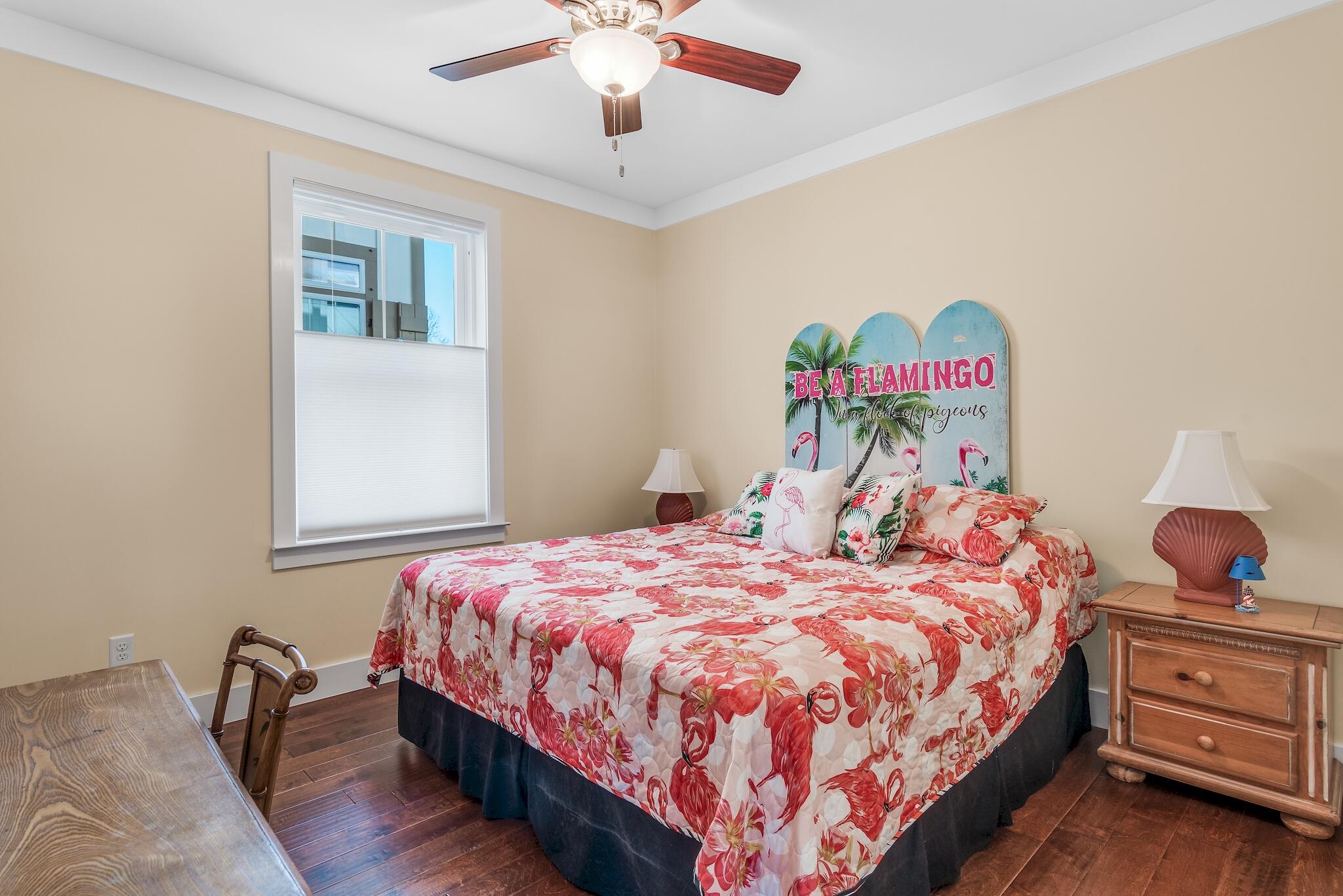 225 Turtle Cove Panama City Beach, FL 32413 - Photo 14 of 43 a bedroom with a bed and a dresser