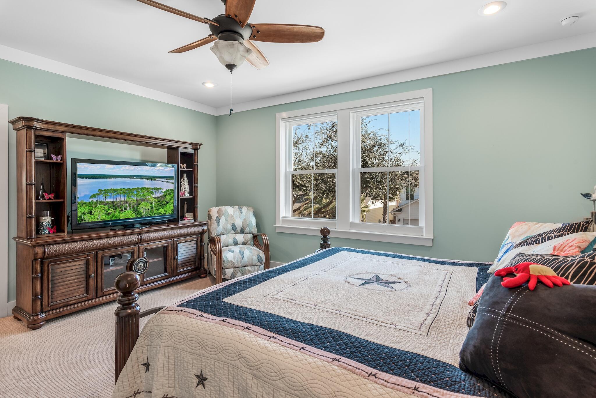 225 Turtle Cove Panama City Beach, FL 32413 - Photo 19 of 43 a living room with furniture and a flat screen tv