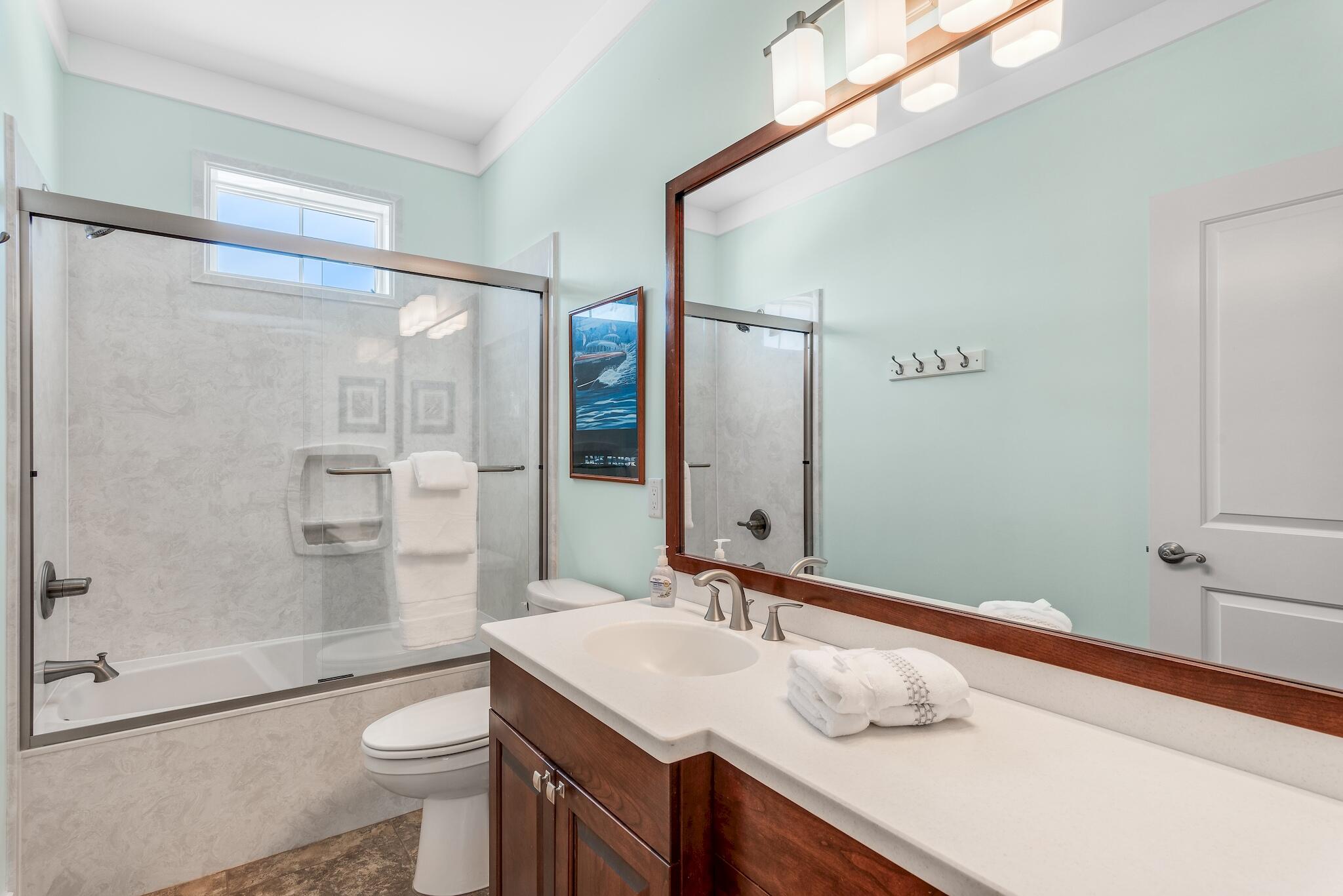 225 Turtle Cove Panama City Beach, FL 32413 - Photo 26 of 43 a bathroom with a sink a toilet and shower