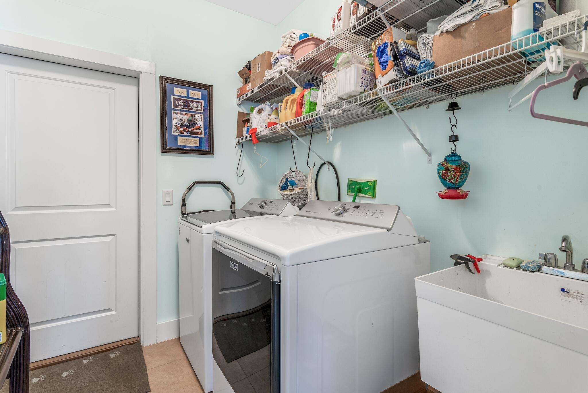 225 Turtle Cove Panama City Beach, FL 32413 - Photo 27 of 43 a utility room with dryer and washer