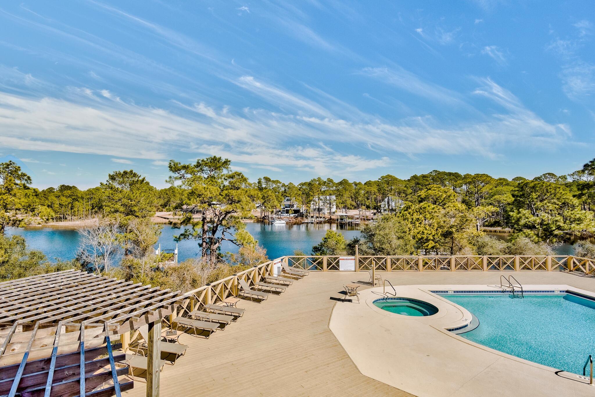225 Turtle Cove Panama City Beach, FL 32413 - Photo 31 of 43 a view of a swimming pool with an outdoor seating