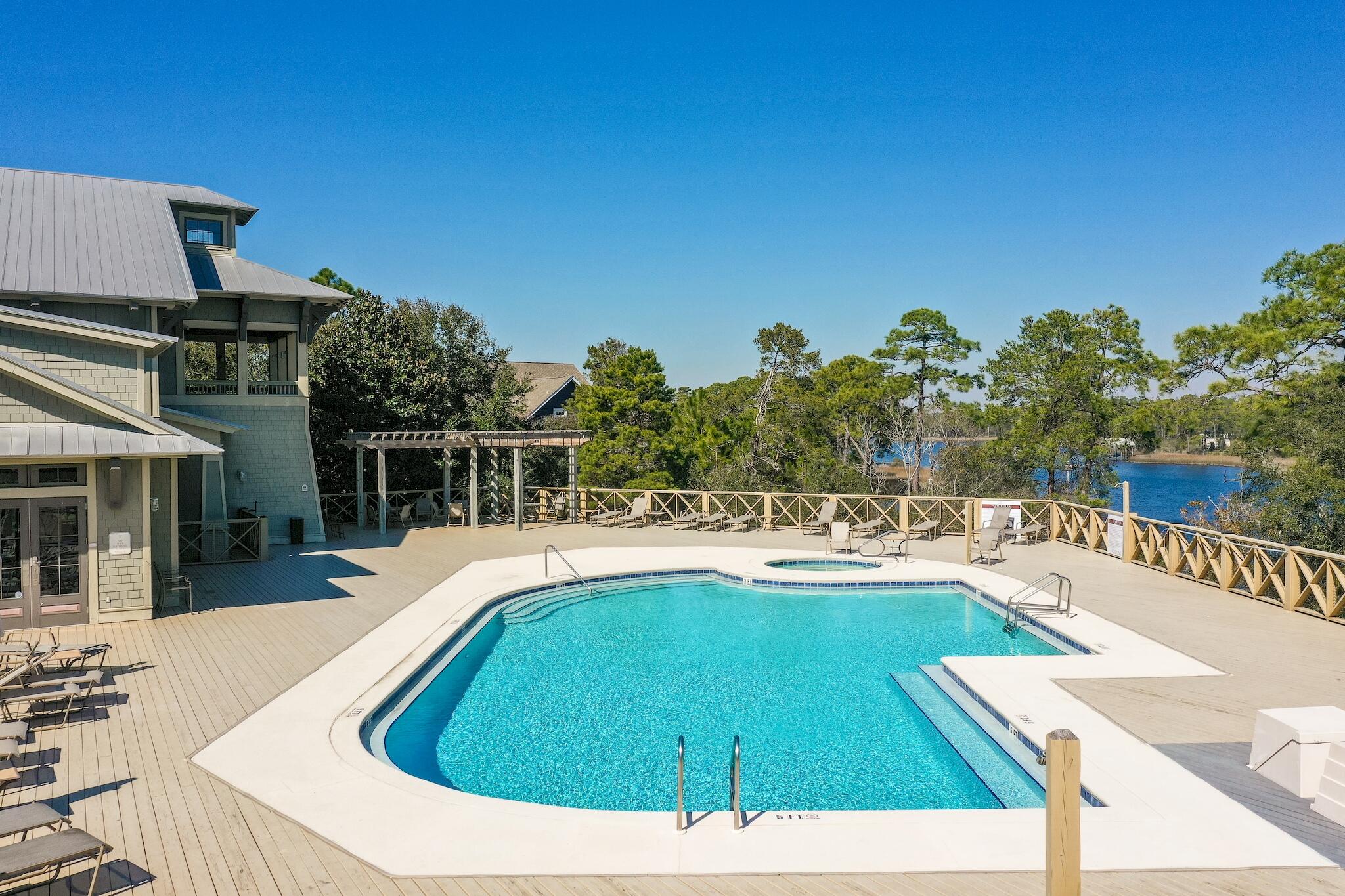 225 Turtle Cove Panama City Beach, FL 32413 - Photo 33 of 43 a view of a swimming pool with a patio