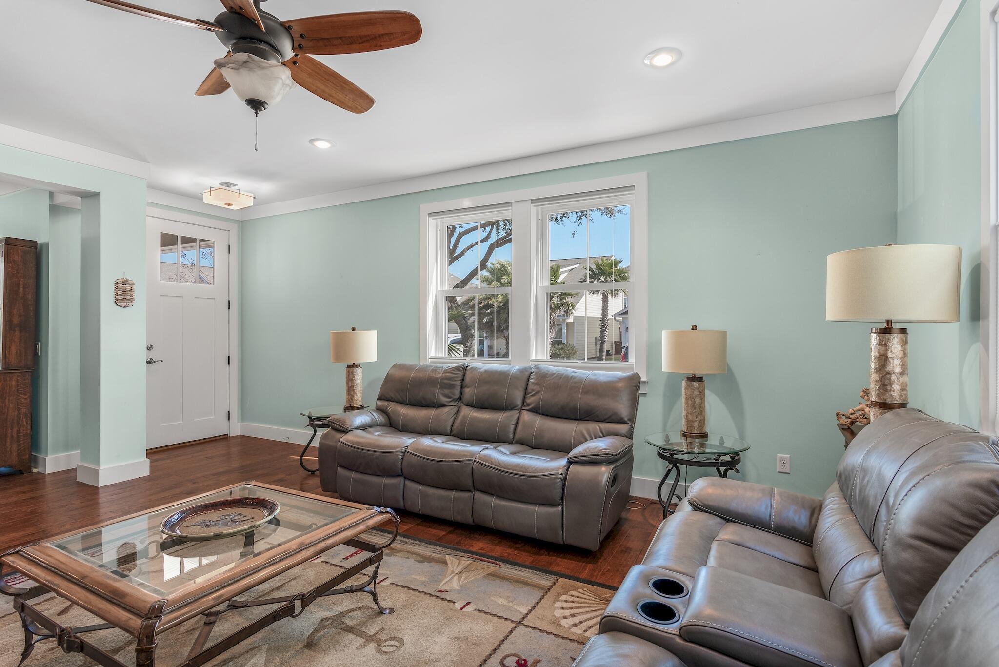 225 Turtle Cove Panama City Beach, FL 32413 - Photo 4 of 43 a living room with furniture and a window
