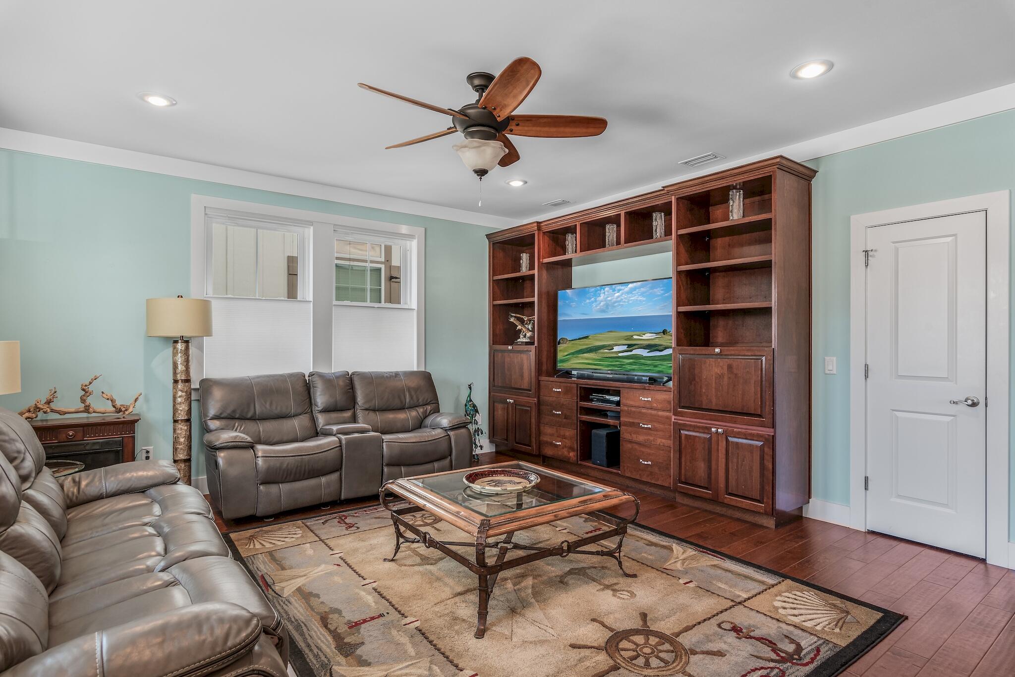 225 Turtle Cove Panama City Beach, FL 32413 - Photo 6 of 43 a living room with furniture and a flat screen tv